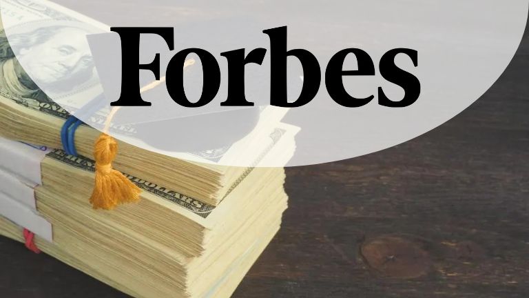 Image of the Forbes logo over a stack of money with a graduation tassel, representing student loan or education finance coverage.