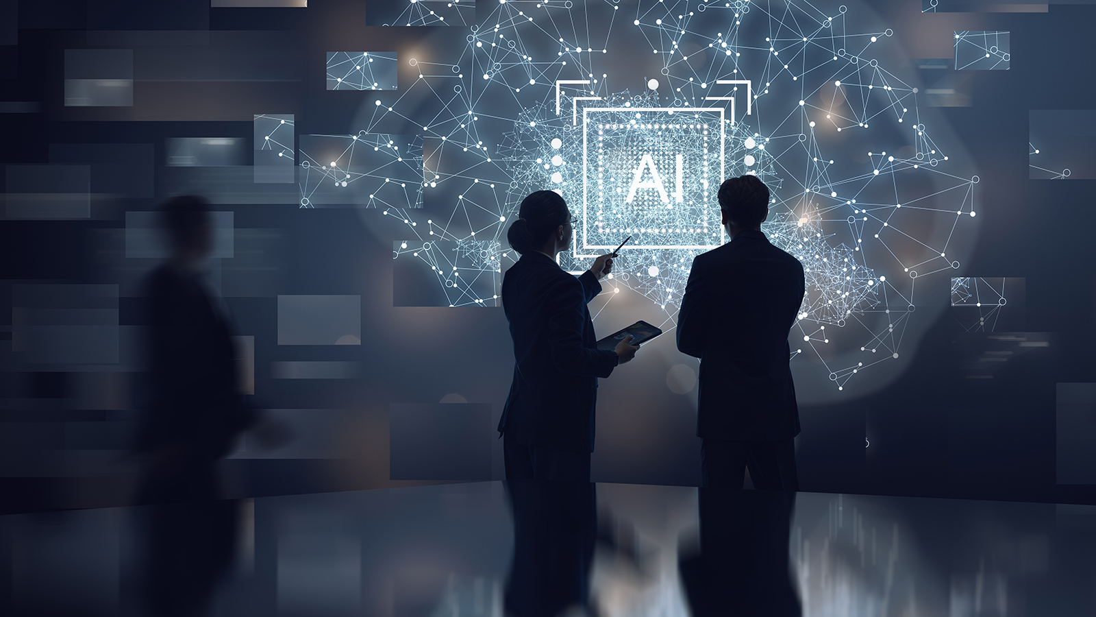 Business colleagues discussing artificial intelligence on a glowing screen