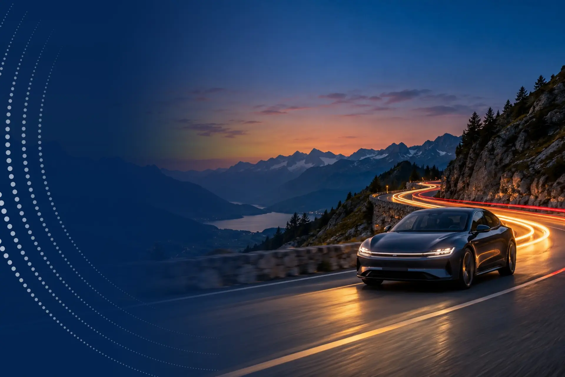 A dark saloon car on a winding mountain road at dusk, trailed by streaks of light.