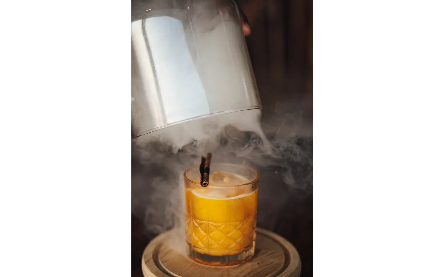Smoking whisky cocktail served in a crystal glass