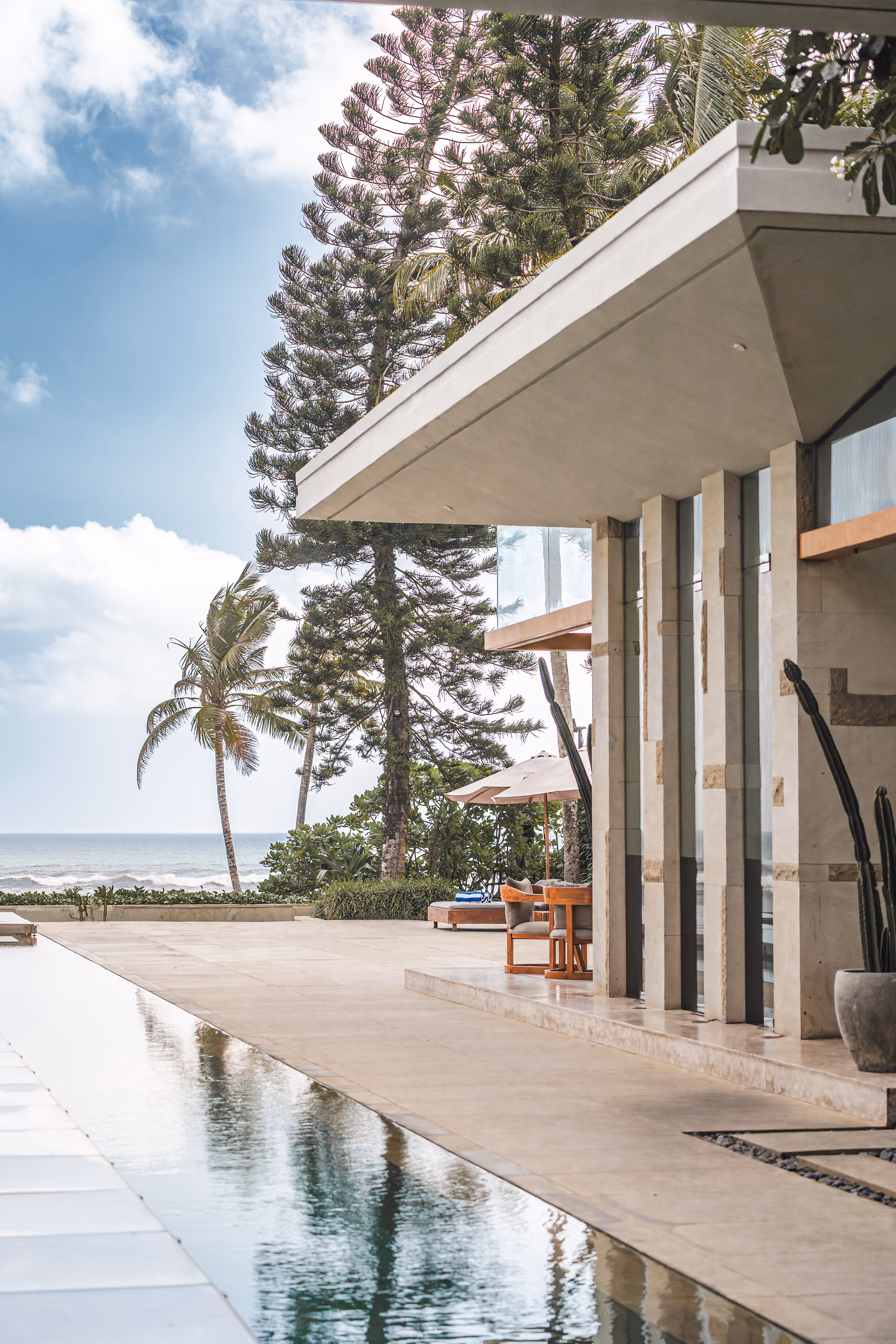 Oceanfront terrace and infinity pool at Villa Vedas, a partner property in Tabanan, Bali