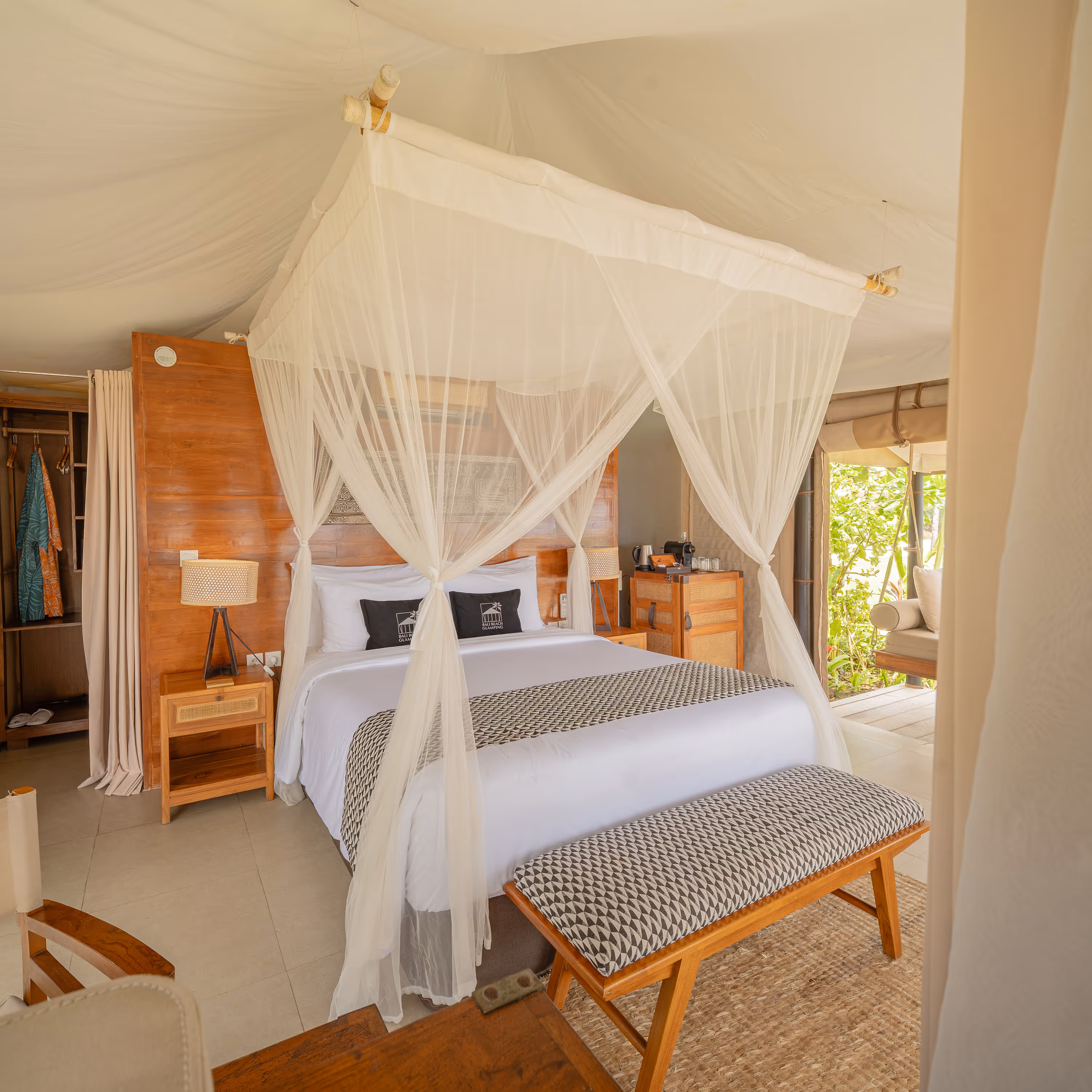 Four-poster canopy bed in a tented suite bedroom at a partner property
