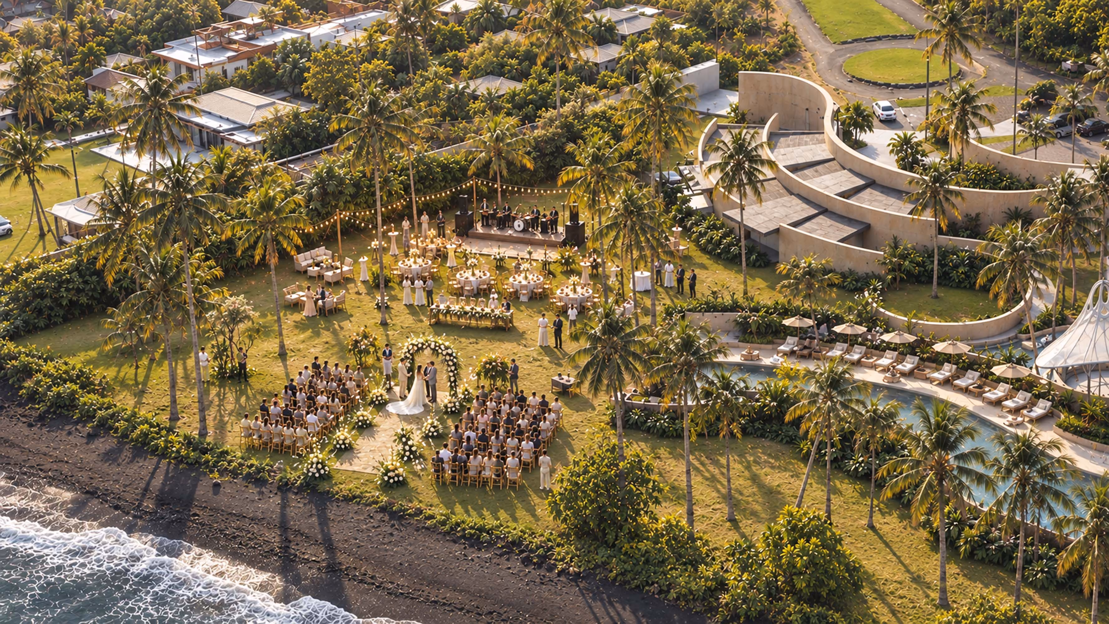 Aerial view of an oceanfront wedding ceremony and reception set up on the lawn