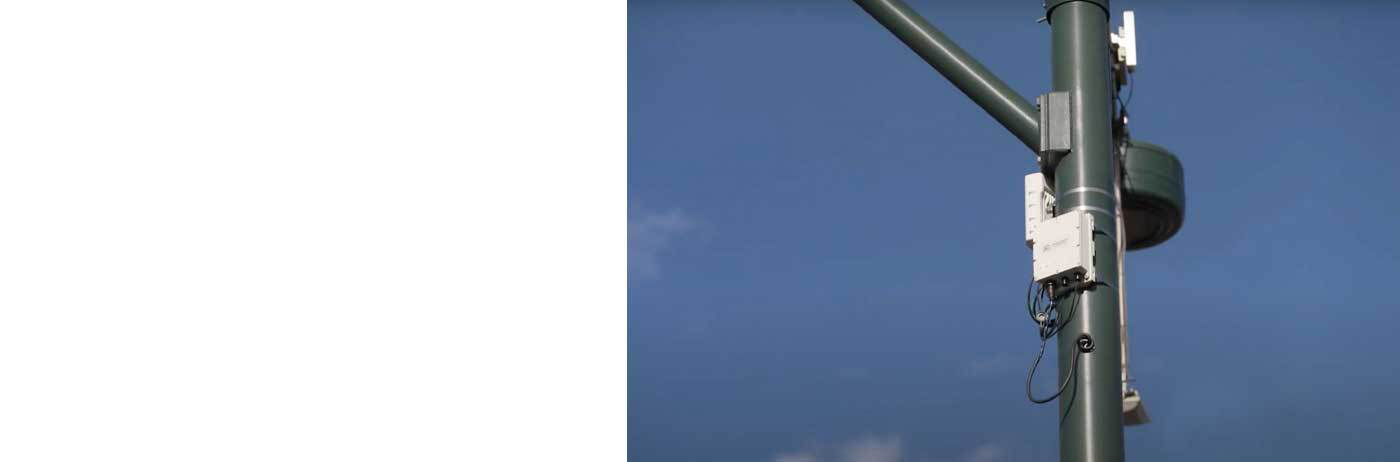 Wireless network extension hardware mounted on light pole