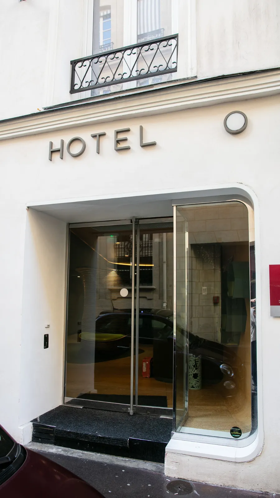 White facade and glass entrance of the ORA-ÏTO design hotel, Rue Hérold, Paris 1st arrondissement