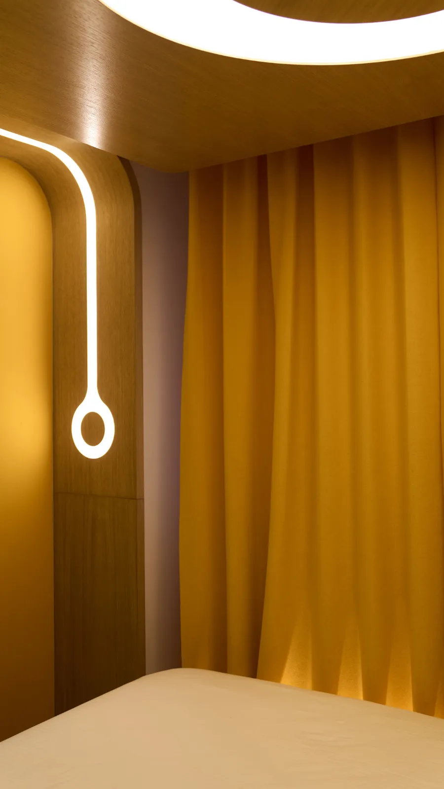 Mustard curtains and ring light, room at the ORA-ÏTO design hotel, Paris 1st arrondissement