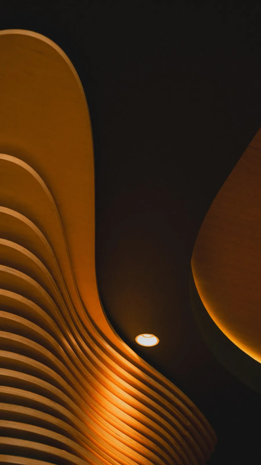 Ceiling sculpted with amber wooden slats, ORA-ÏTO design hotel in Paris 1st arrondissement