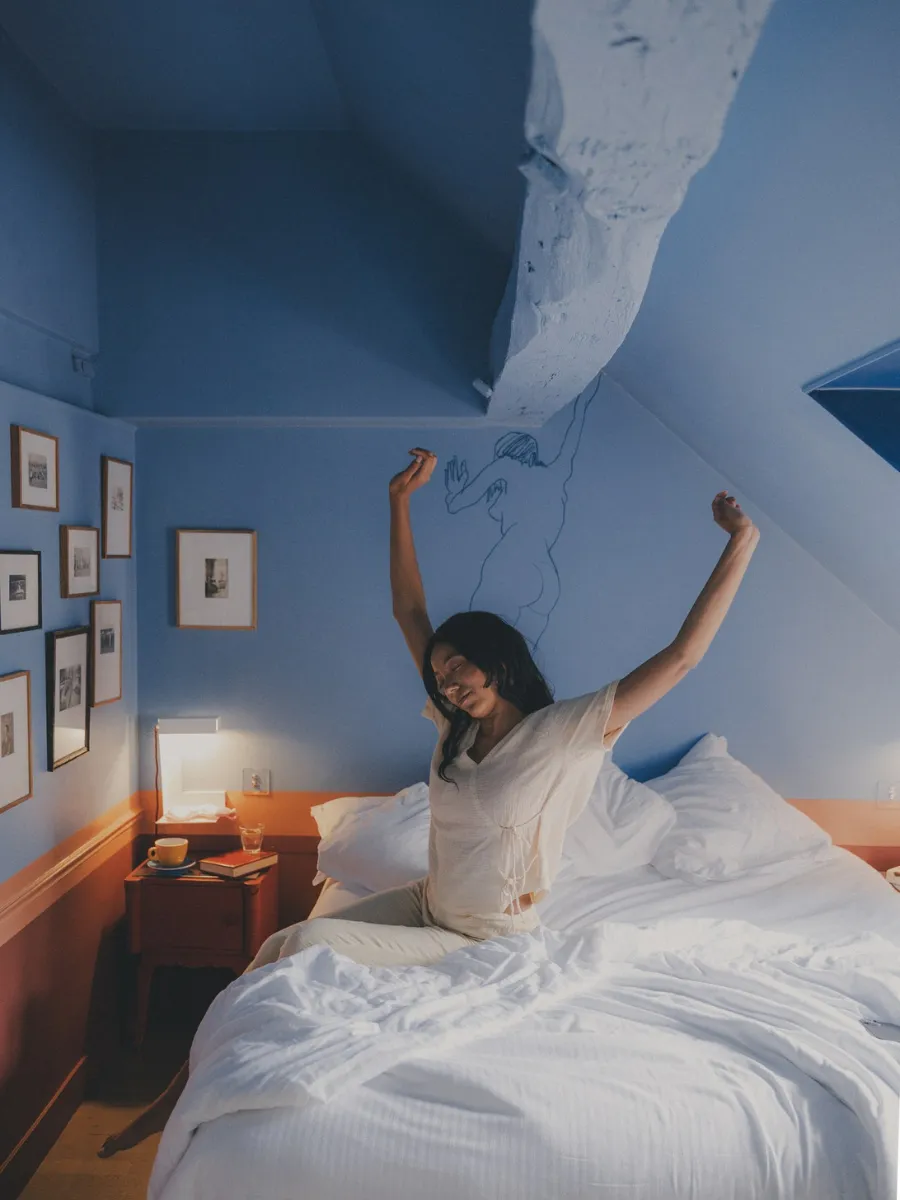 Wake up gently in a blue room under the eaves at Hôtel Crayon, a boutique hotel in Paris's 1st arrondissement