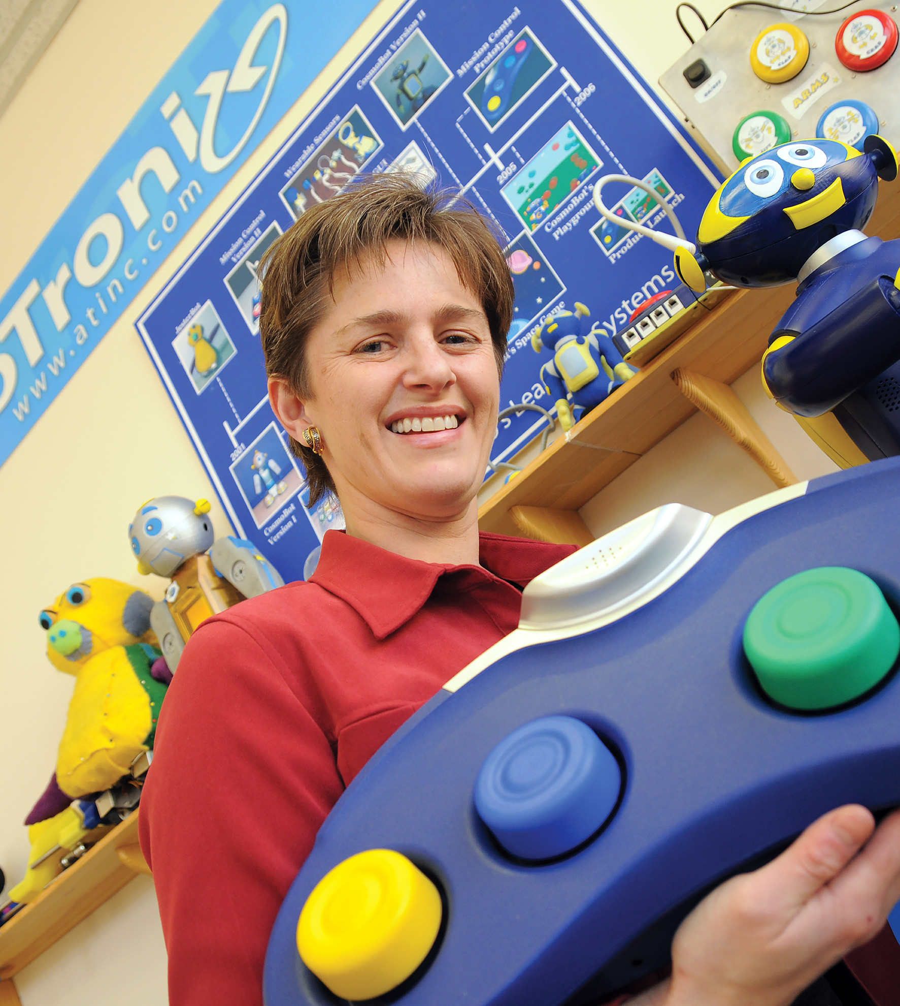 Anthrotronix researcher holding an adaptive game controller
