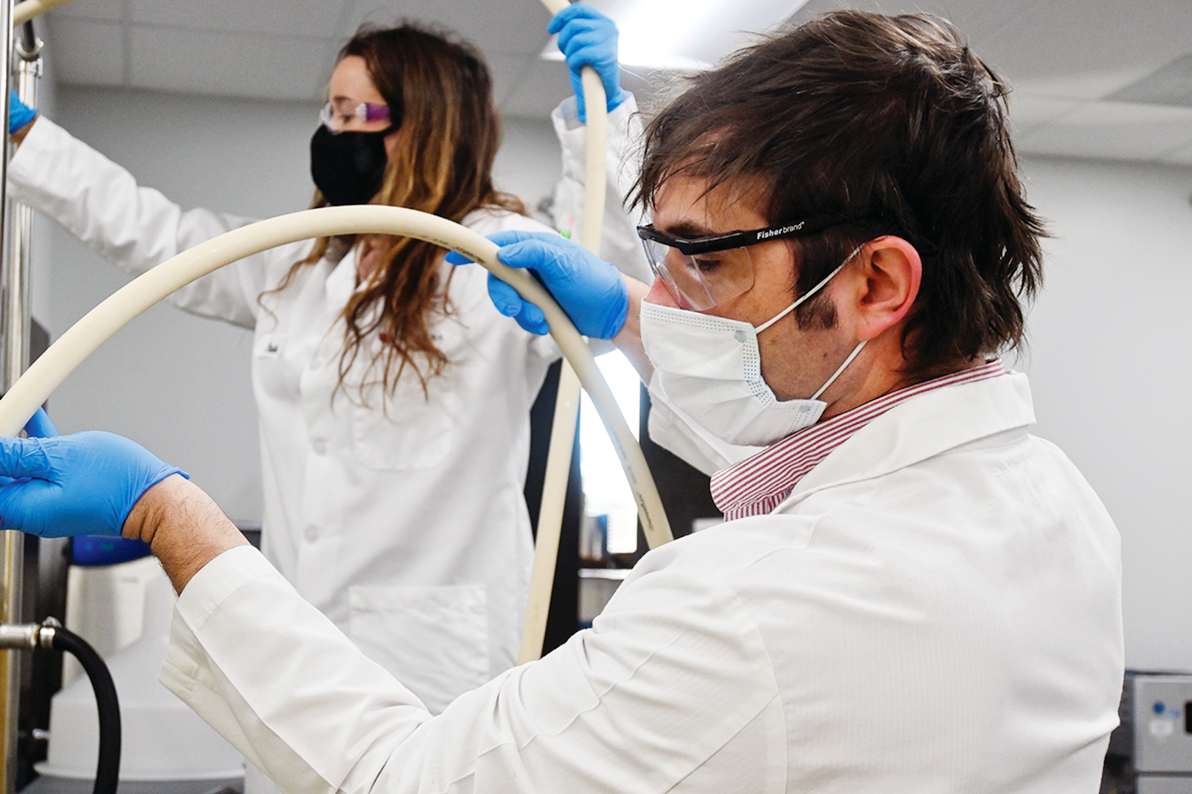 Medcura researchers in a lab developing a hemostatic device