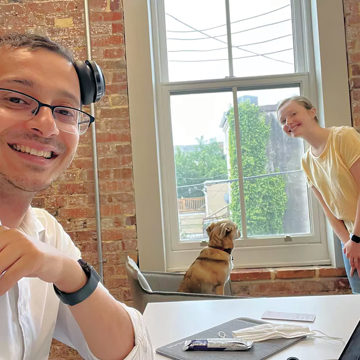 Astek Diagnostics team members working together in their office.