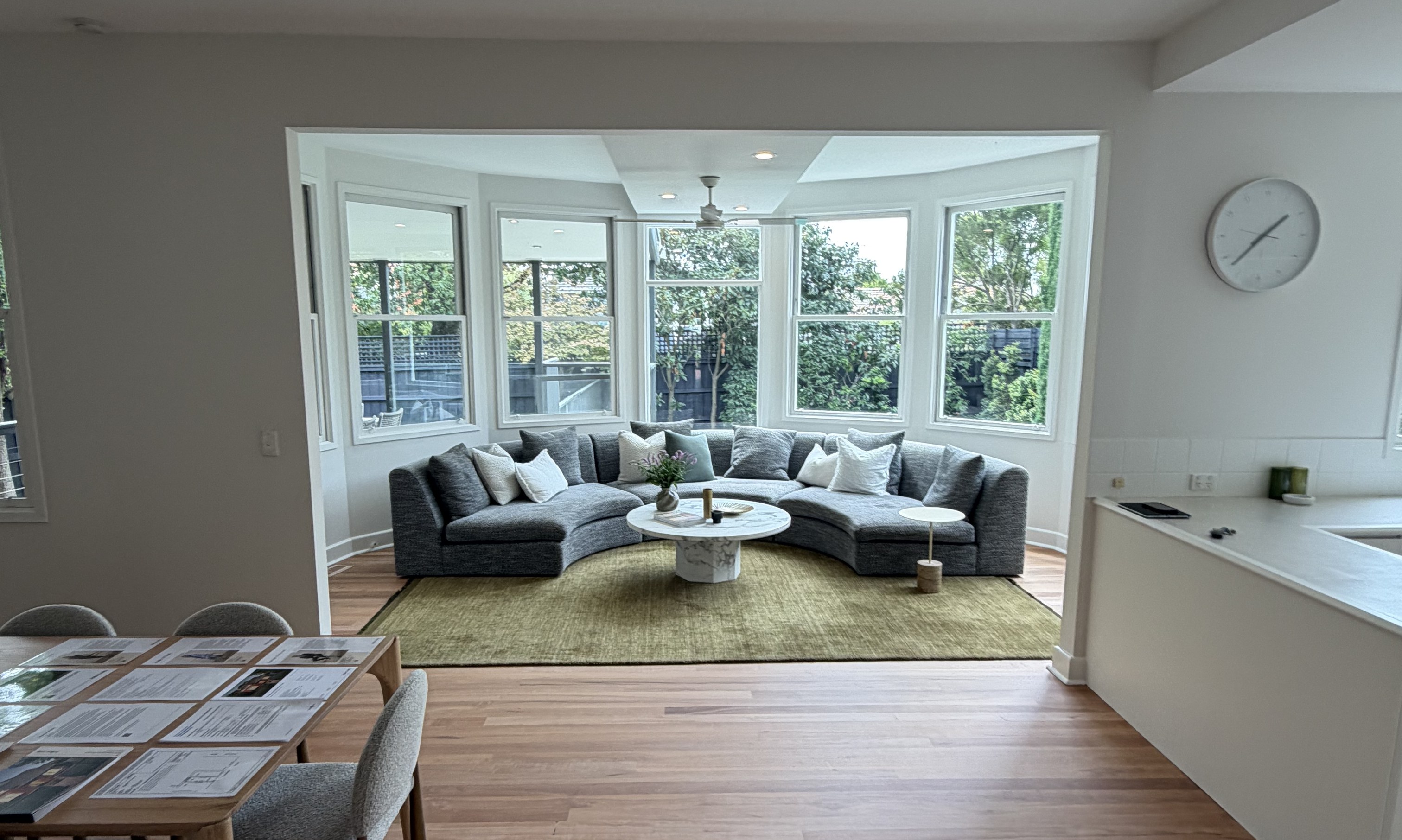 Period living and dining room with bay windows onto the garden