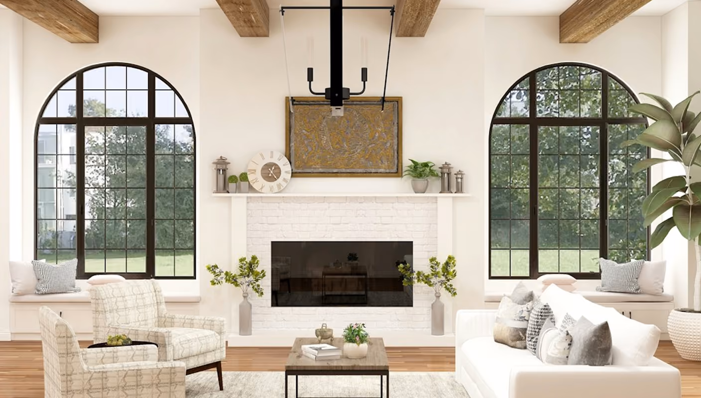 Bright living room with white sofa, patterned chairs, large arched windows, fireplace, and decorative plants.