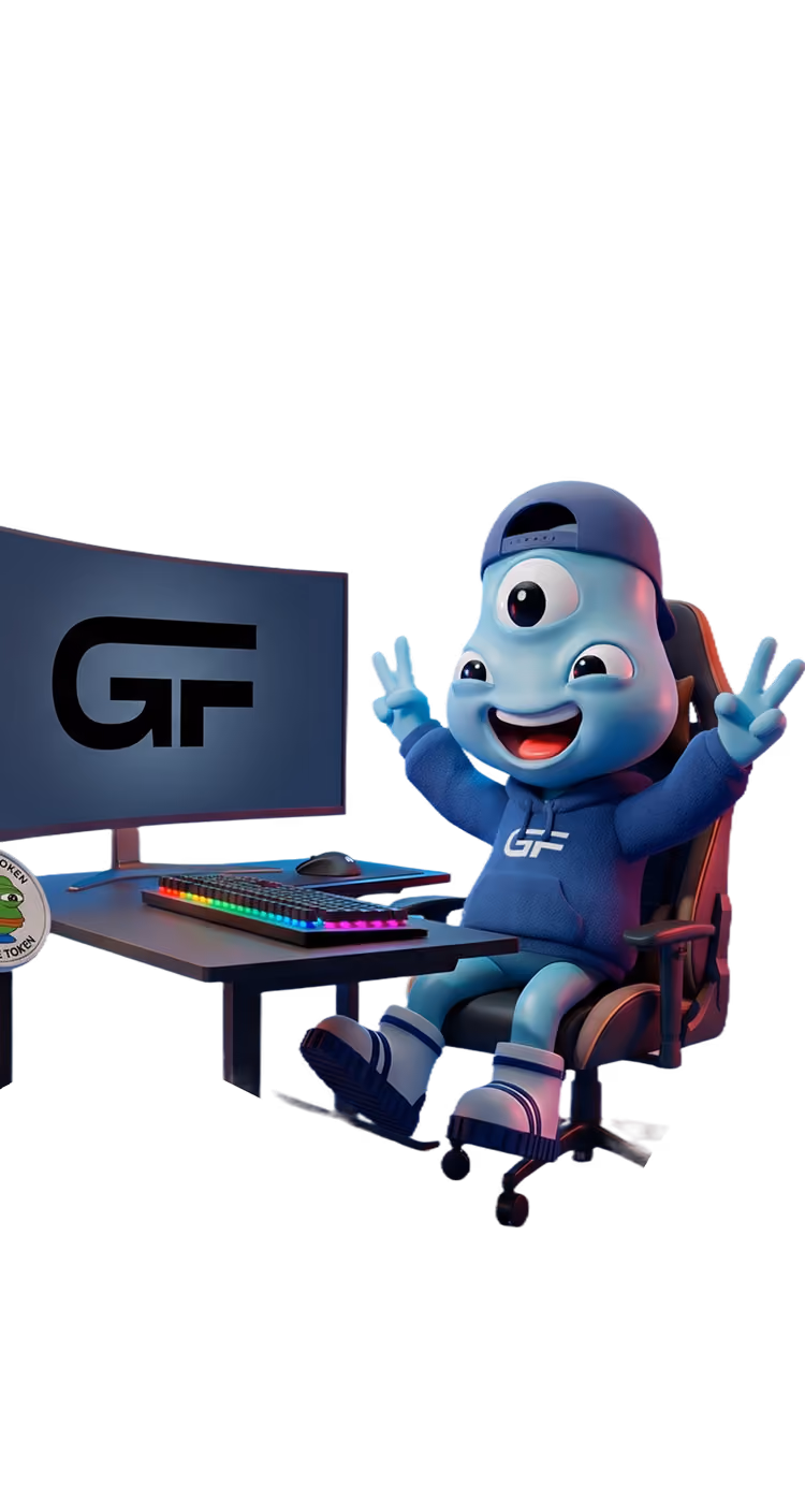 A cheerful blue three-eyed animated character wearing a hoodie and cap sits in a gaming chair at a desk with a keyboard and monitor displaying 'GF'. The character smiles and raises both hands showing peace signs.