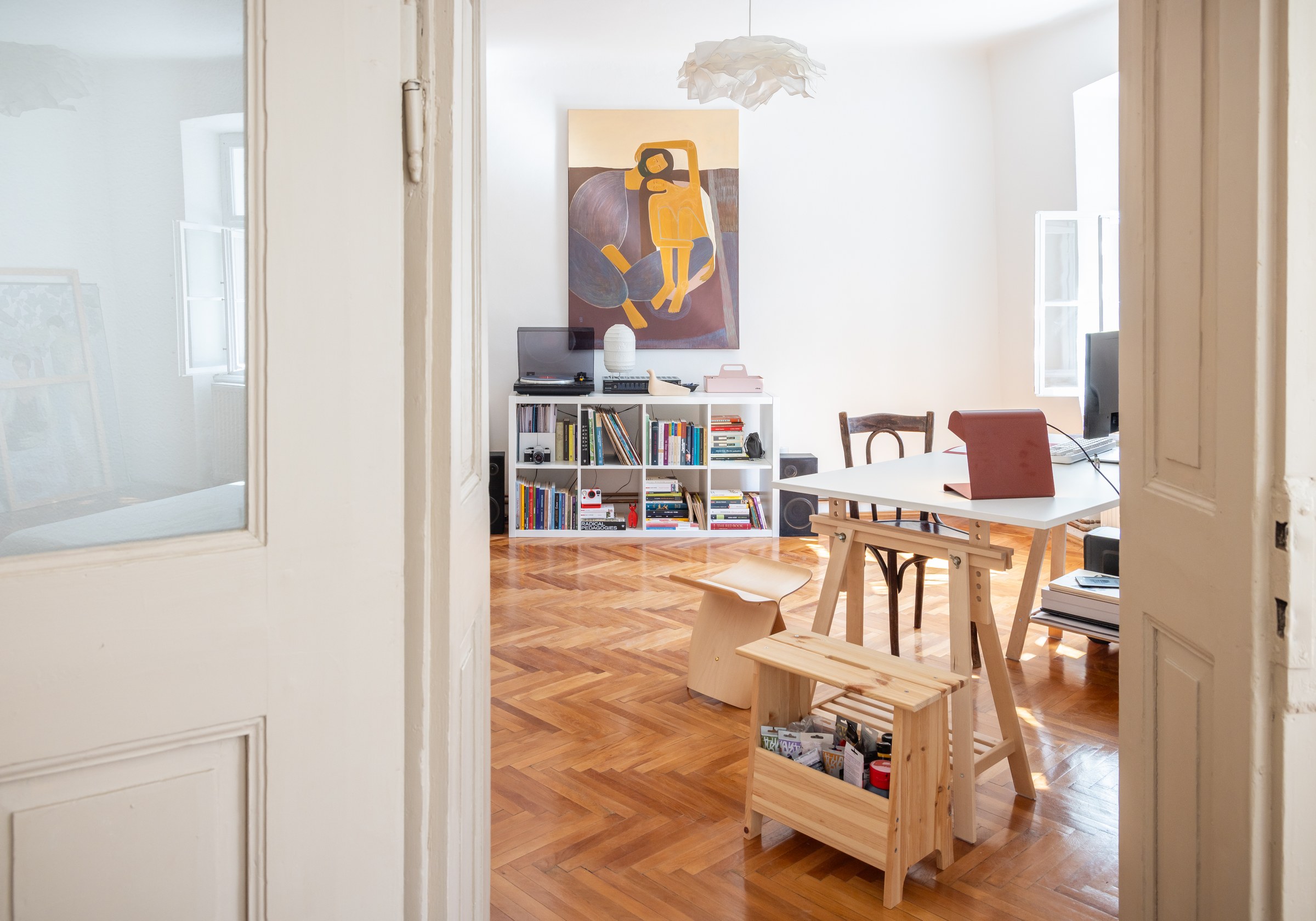 View through the doorway to the furnished living and work space