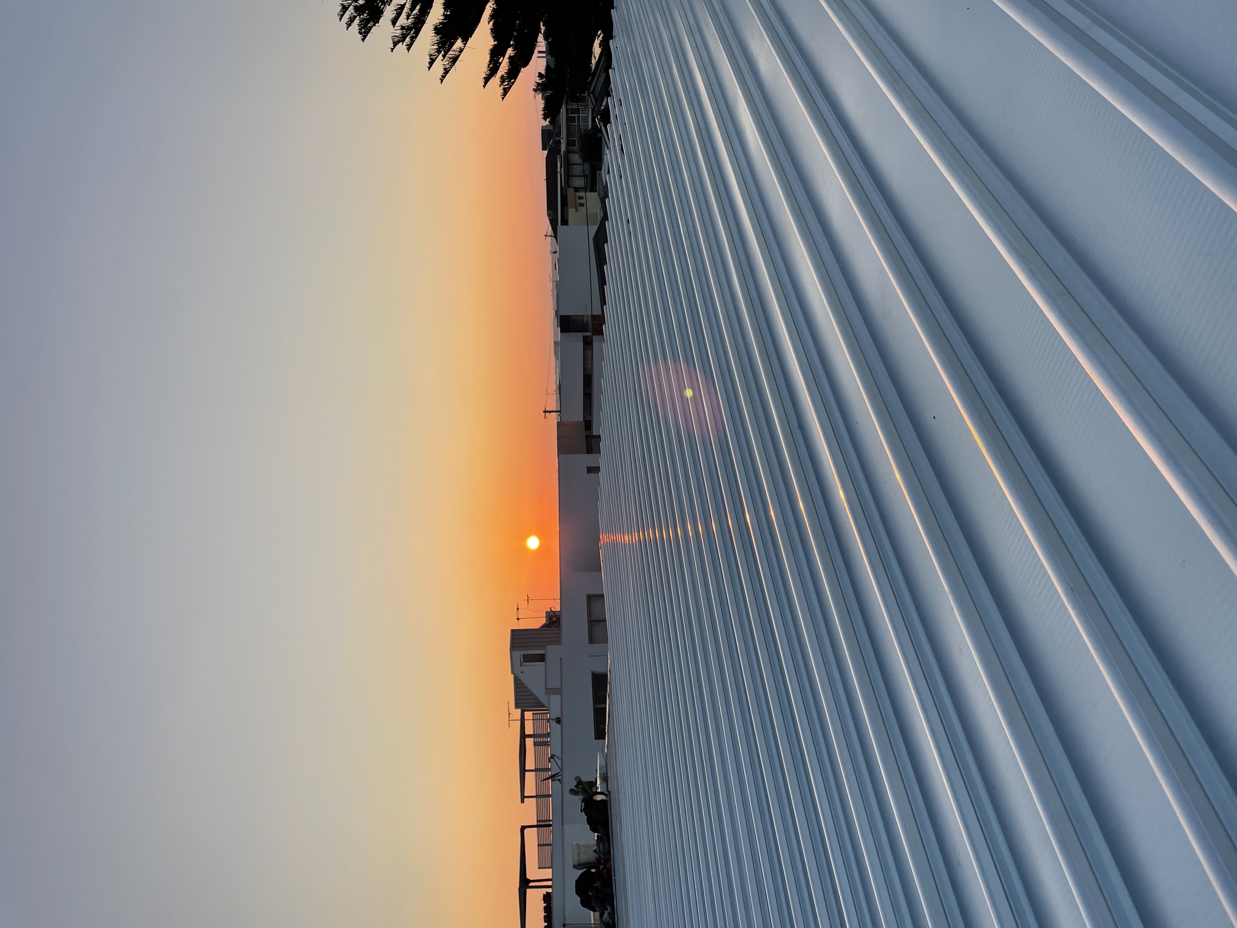 Roof plumbing job at sunset by Infinity and Beyond Plumbing & Gas