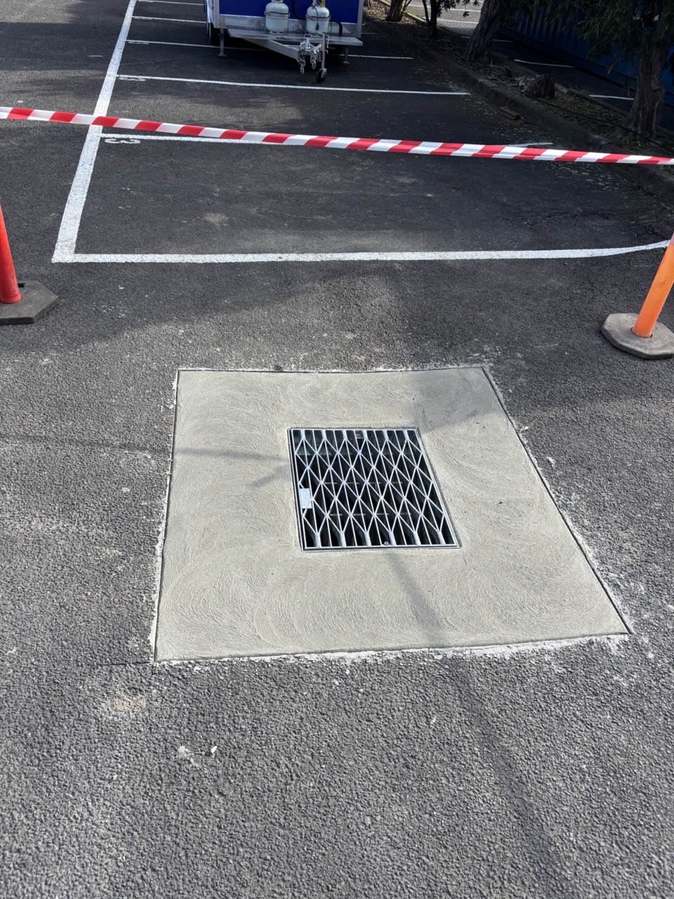 Finished concrete drainage pit rebuild with grate
