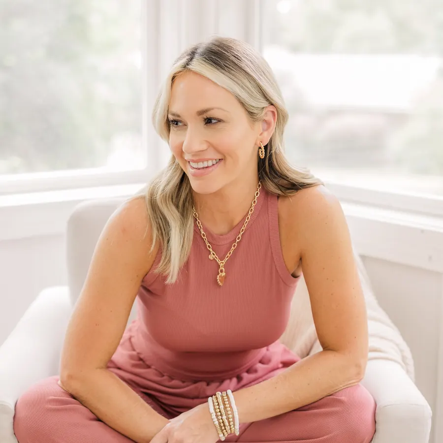 The founder of Harper Meyers and Co in a pink jumpsuit and layered gold necklaces