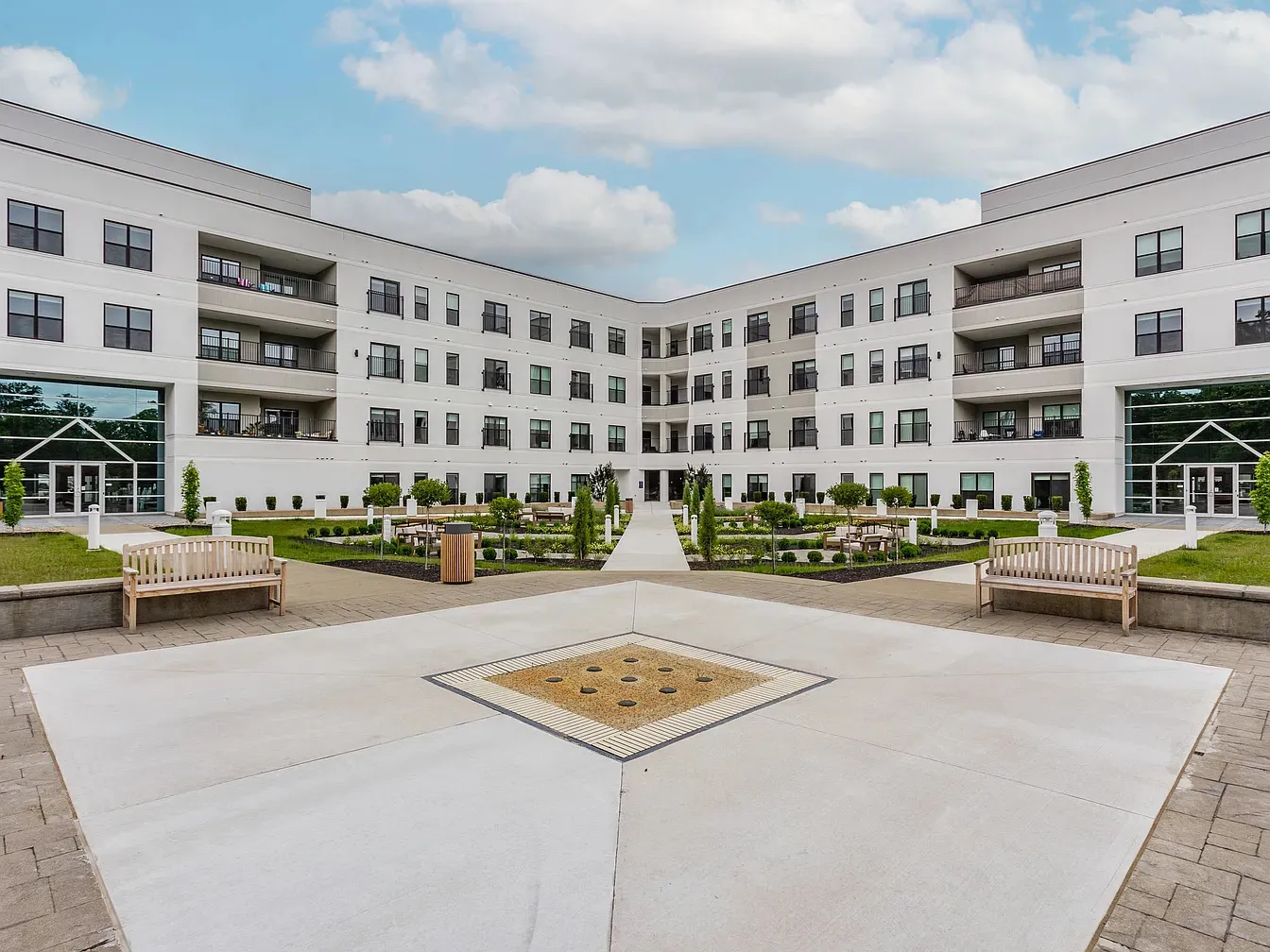 The Altura apartments courtyard build-out with walkways, benches and planting beds