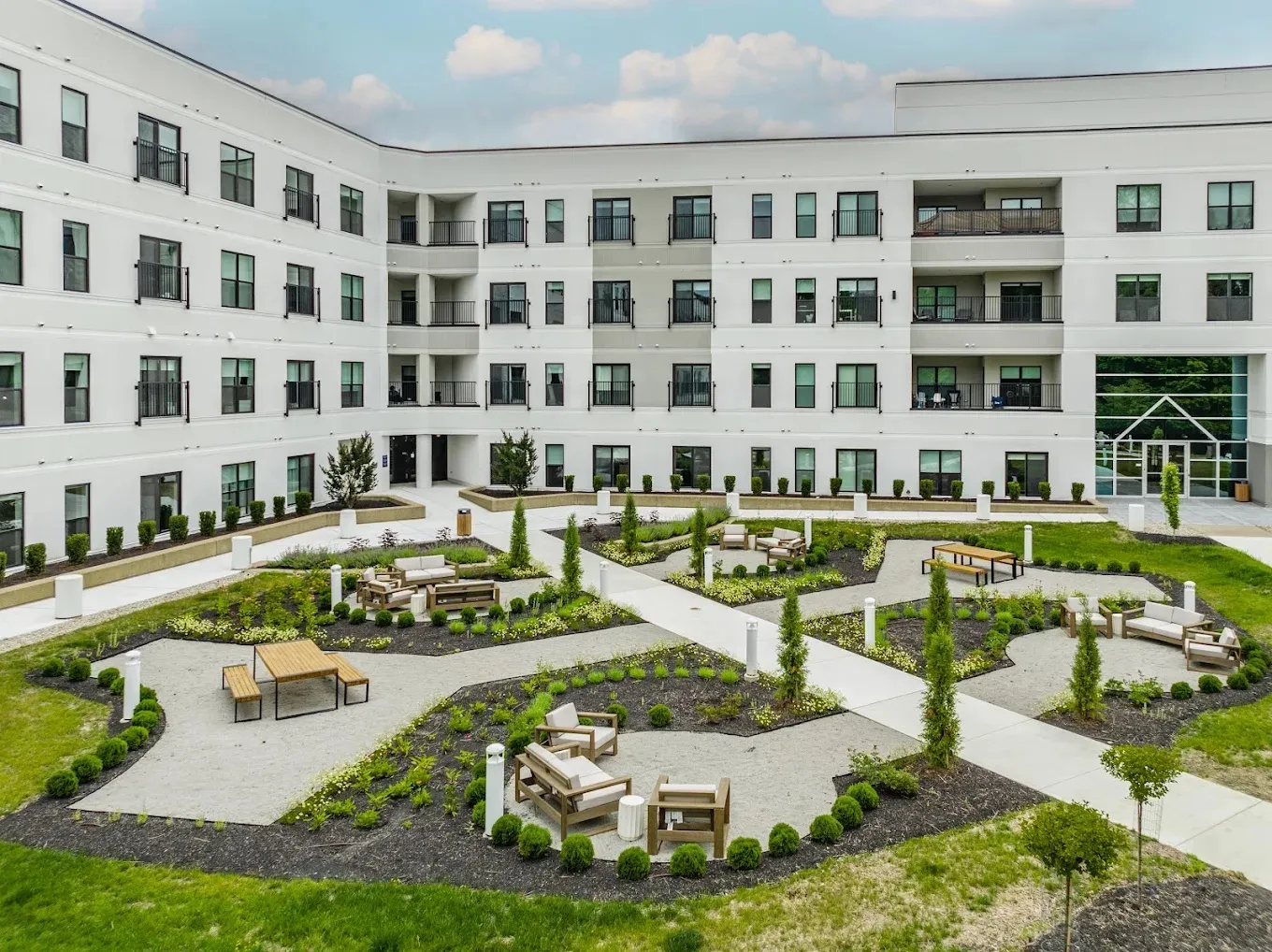 Courtyard seating areas at the Altura apartments surrounded by fresh landscape construction