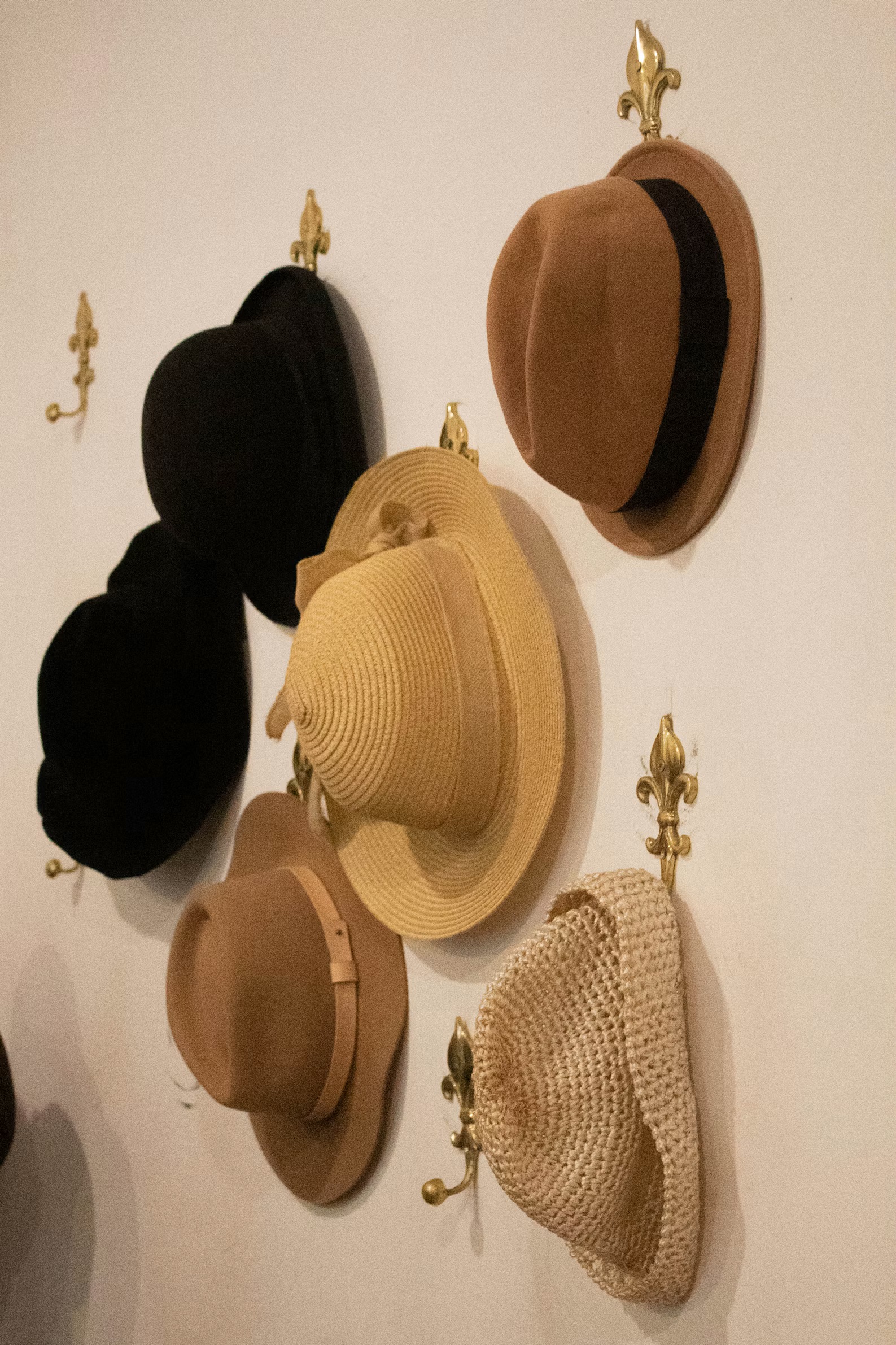 Three different hats representing family, business, and ownership roles