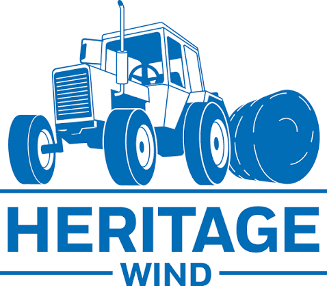 Blue graphic of a tractor next to a large rolled hay bale above the words 'HERITAGE WIND' in bold blue letters.