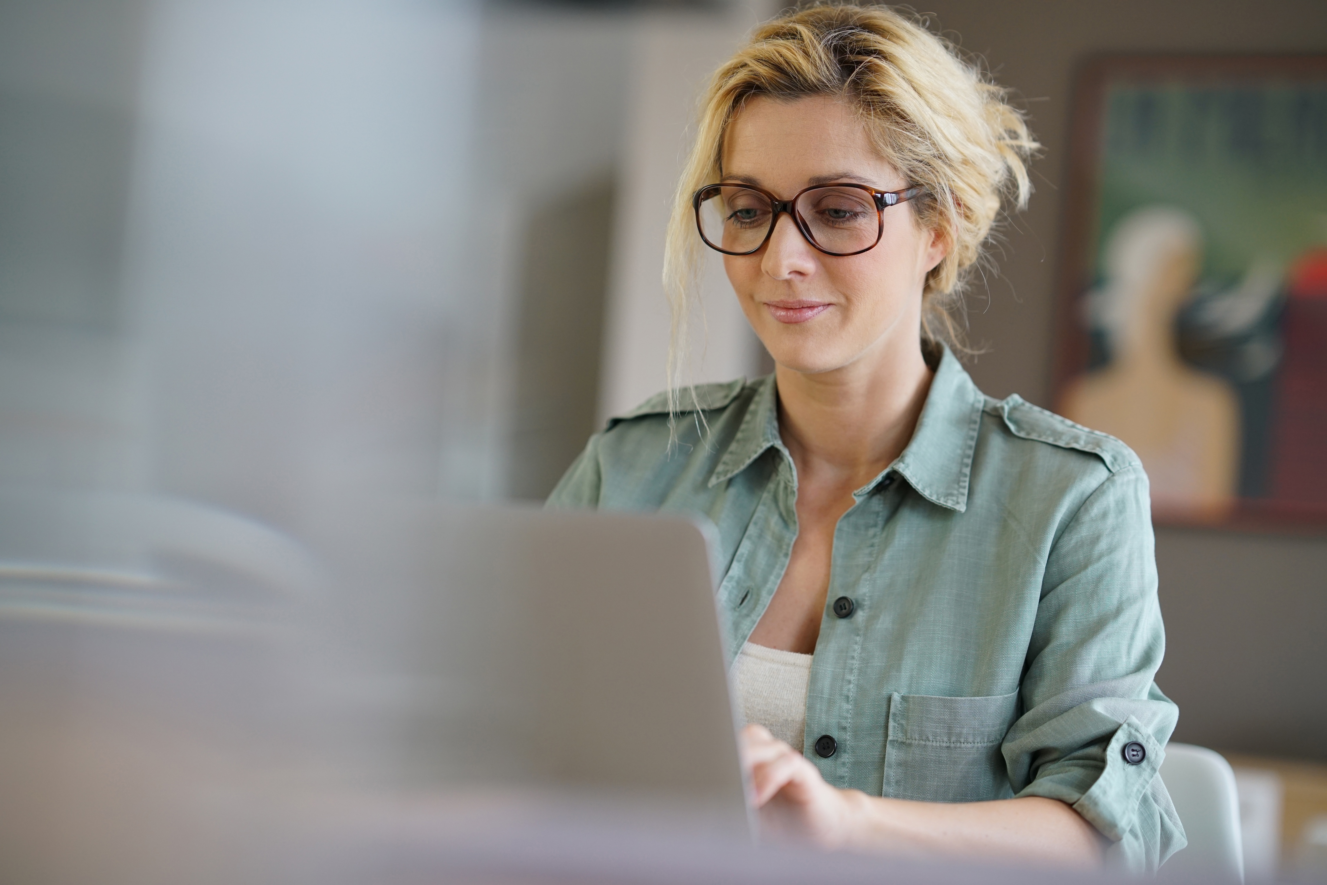 Woman on computer stock image