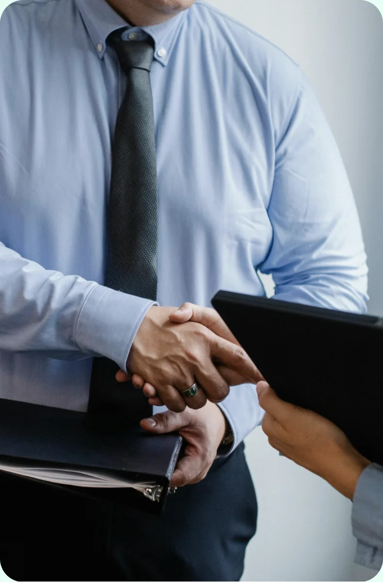 Estate agent shaking hands with a client