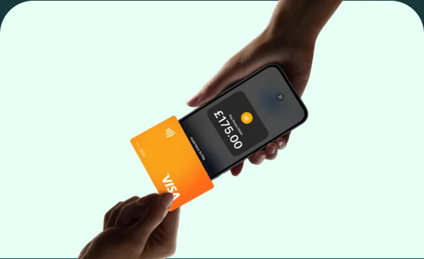 Contactless card tapped on an iPhone to pay
