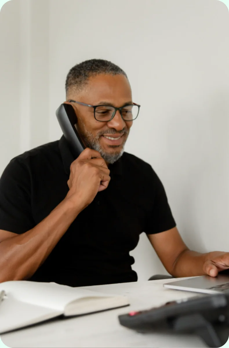 Agent on the phone at his desk