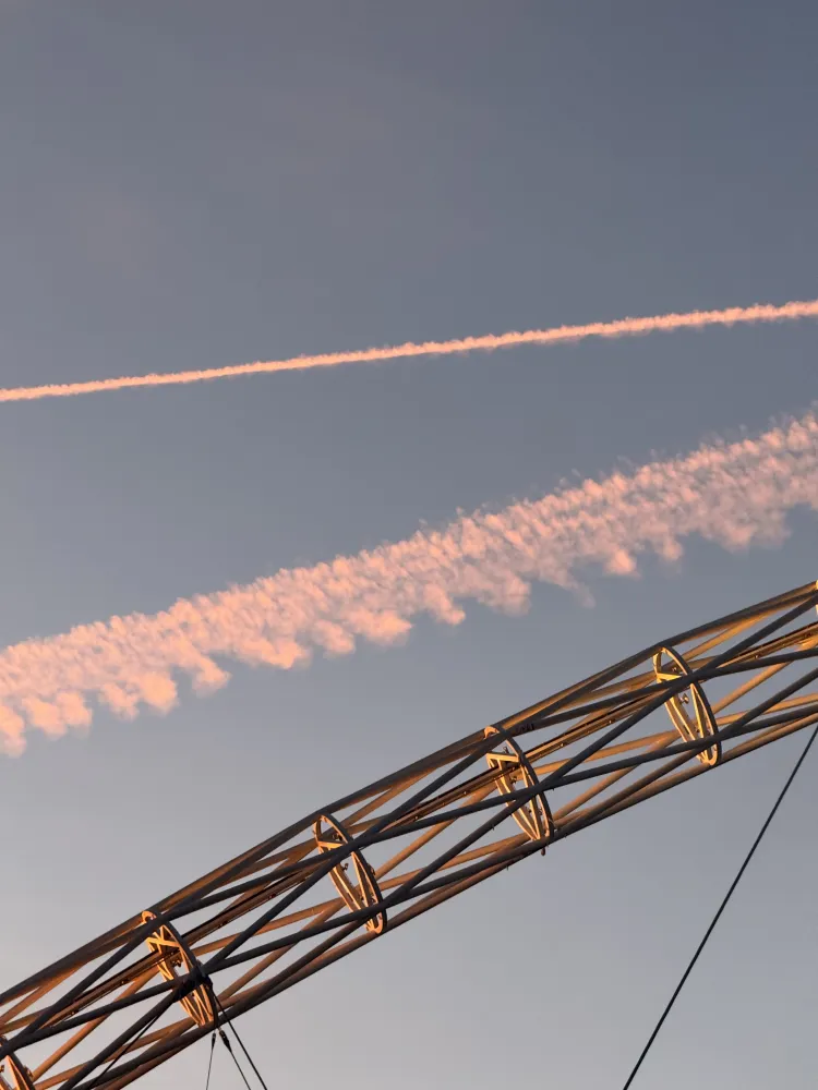 The Wembley arch with Red Arrows trails overhead