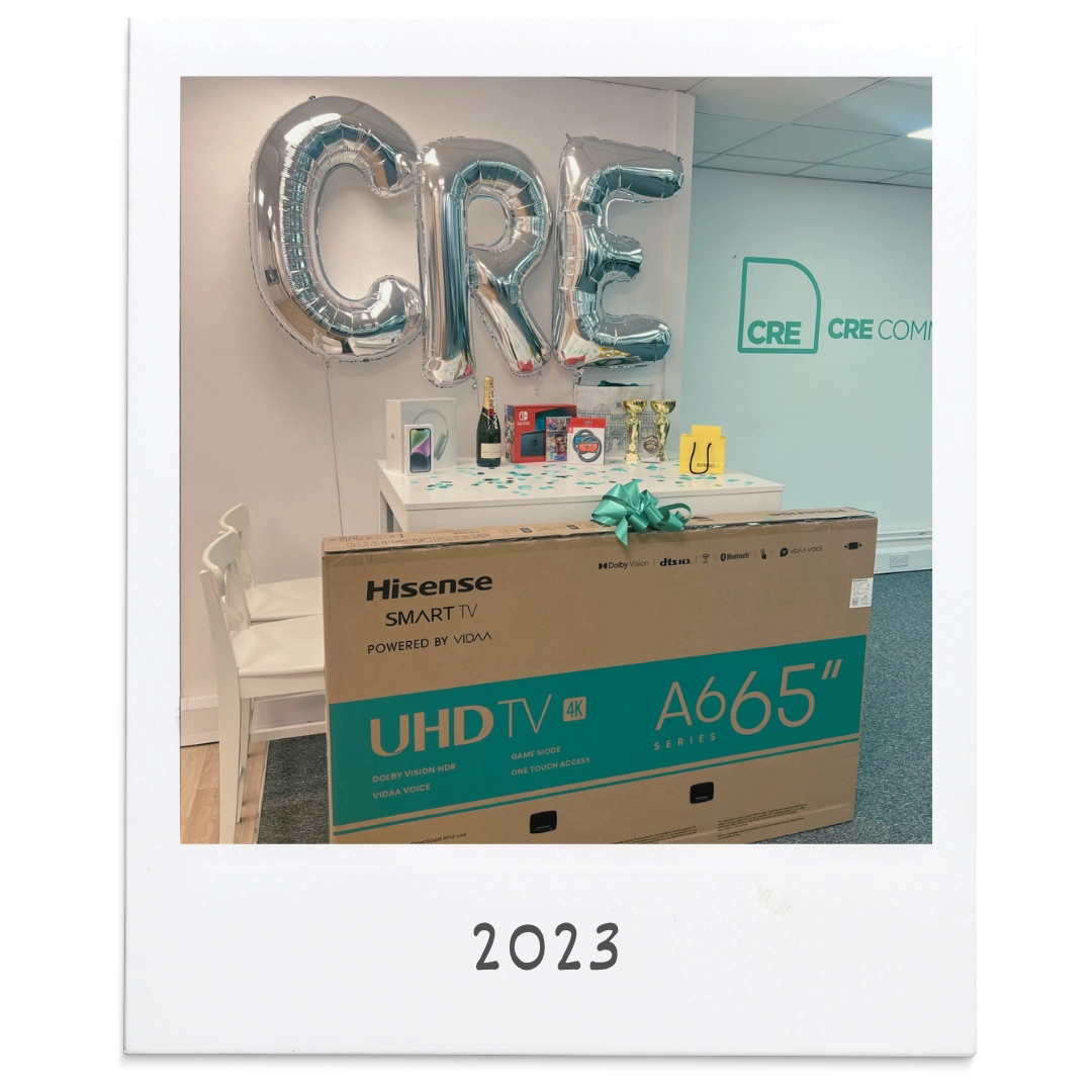 Prizes including a 65-inch TV under CRE balloons at CRE's first Blitz Day in 2023