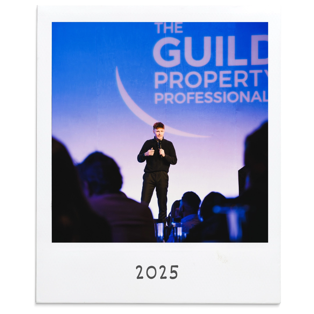 CRE speaking on stage at The Guild of Property Professionals event in 2025