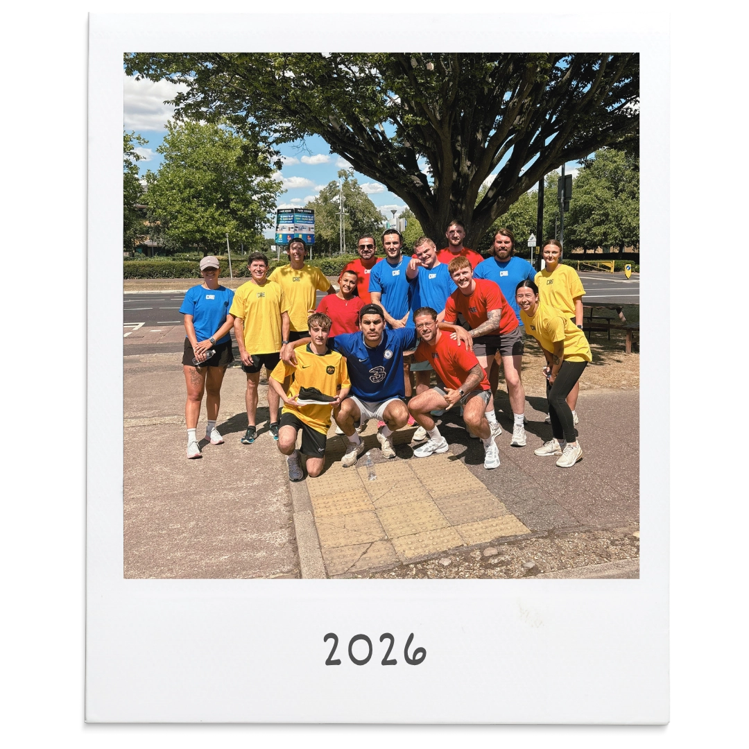 CRE charity committee team in coloured sports tops for a charity challenge in 2026