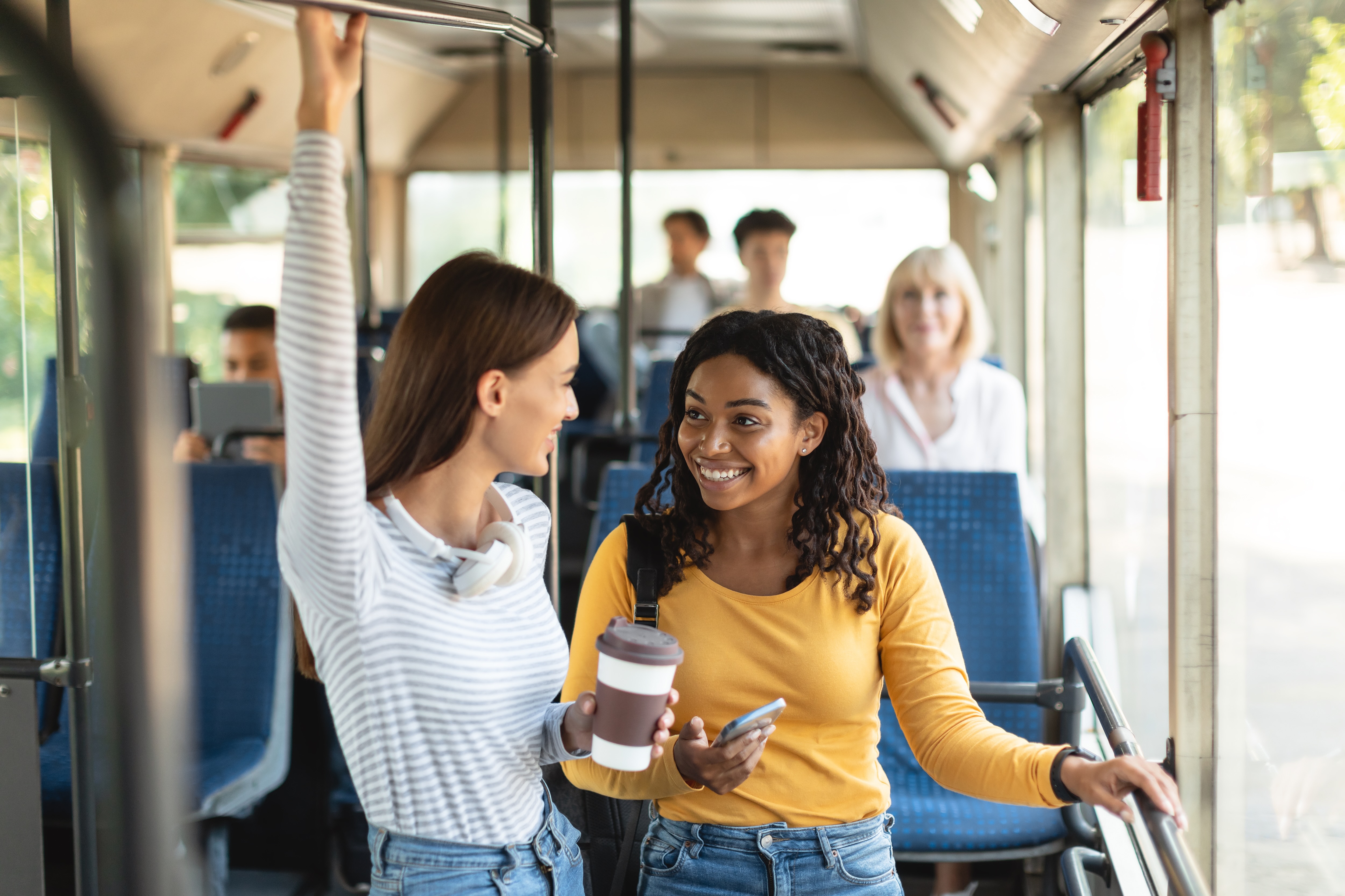 Two girls riding train stock image