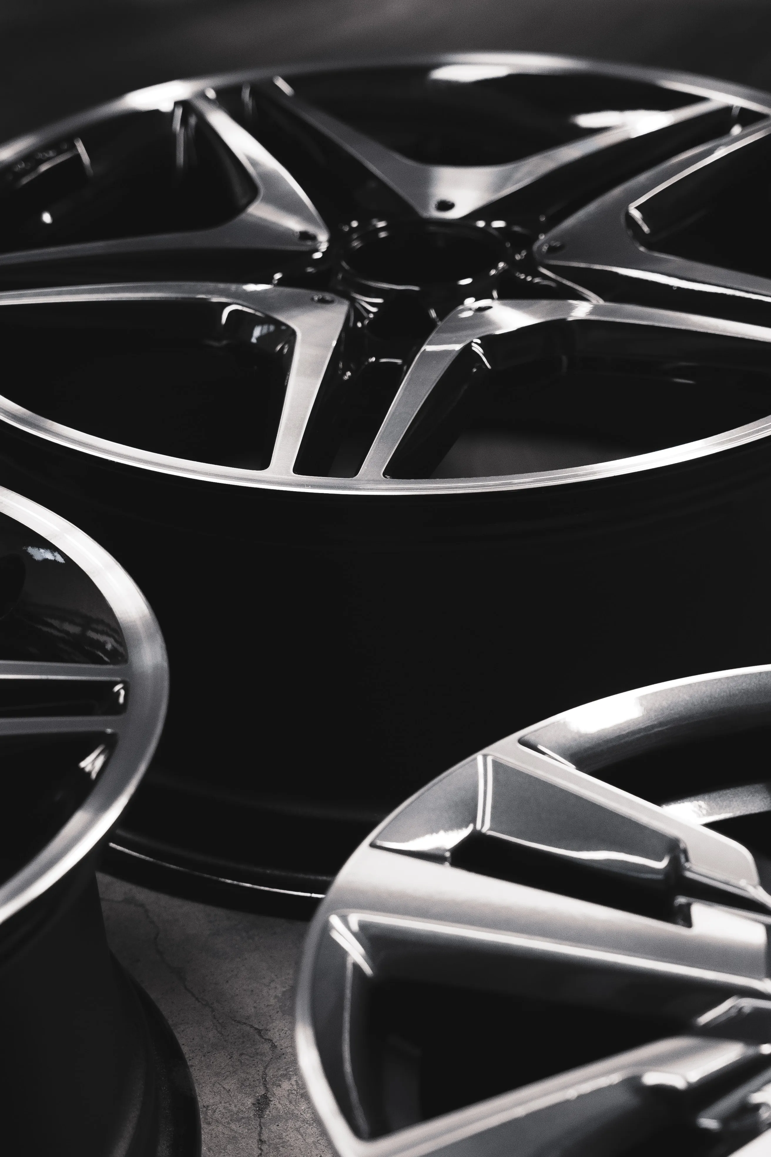 Close-up of dark alloy wheels with silver spokes