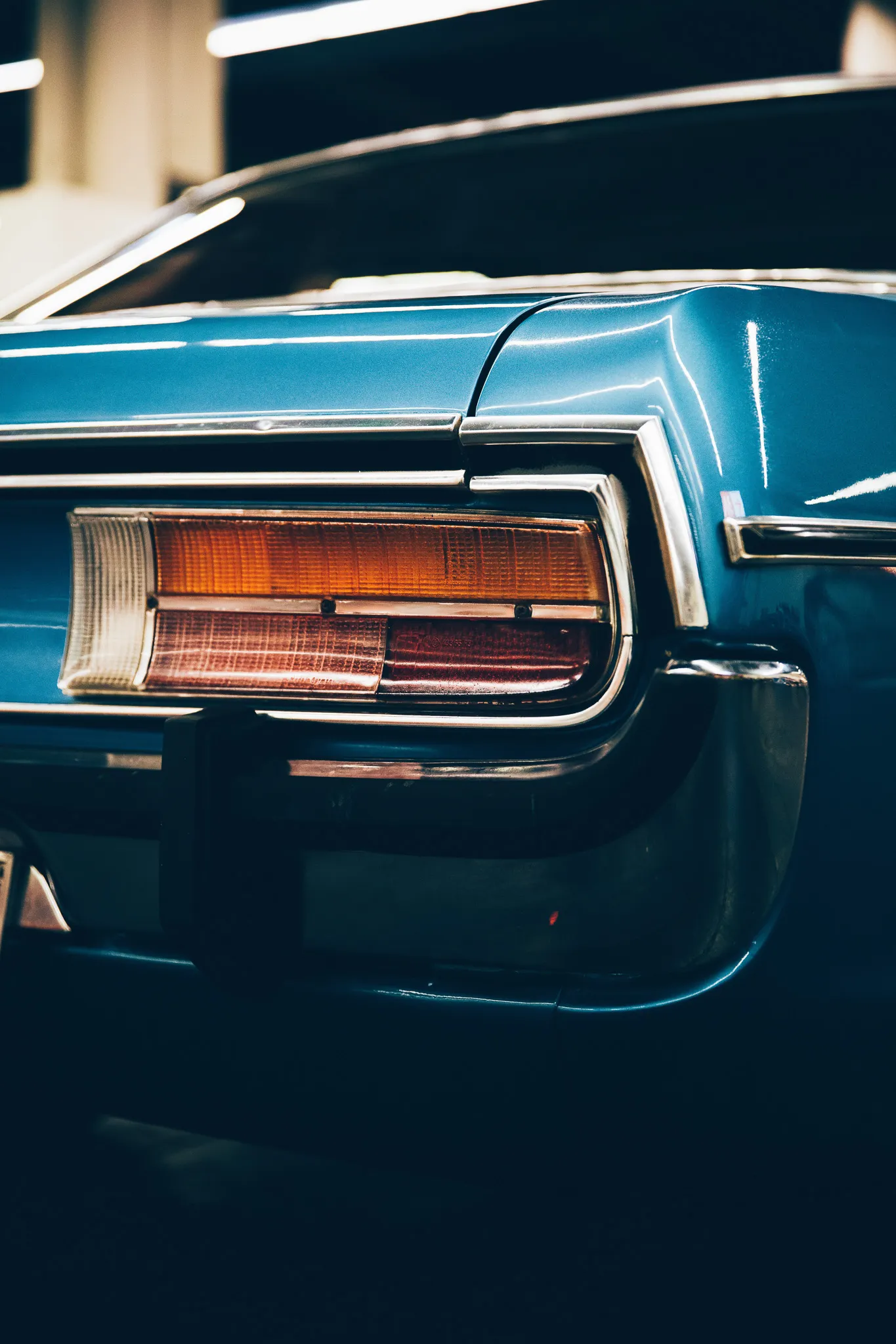 Taillight and blue paint on a classic car