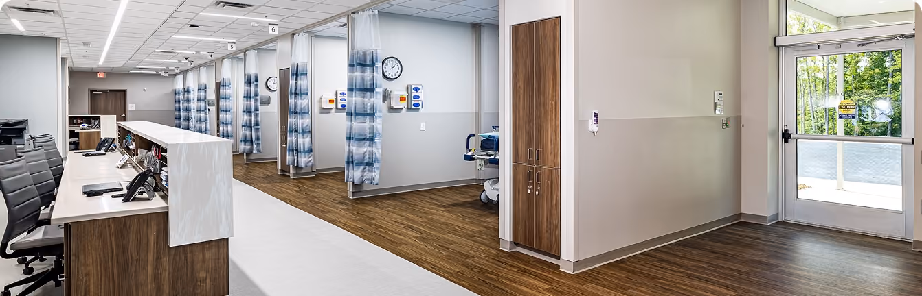 Northeast Digestive's procedure recovery suite with curtained patient bays and a nurses' station.