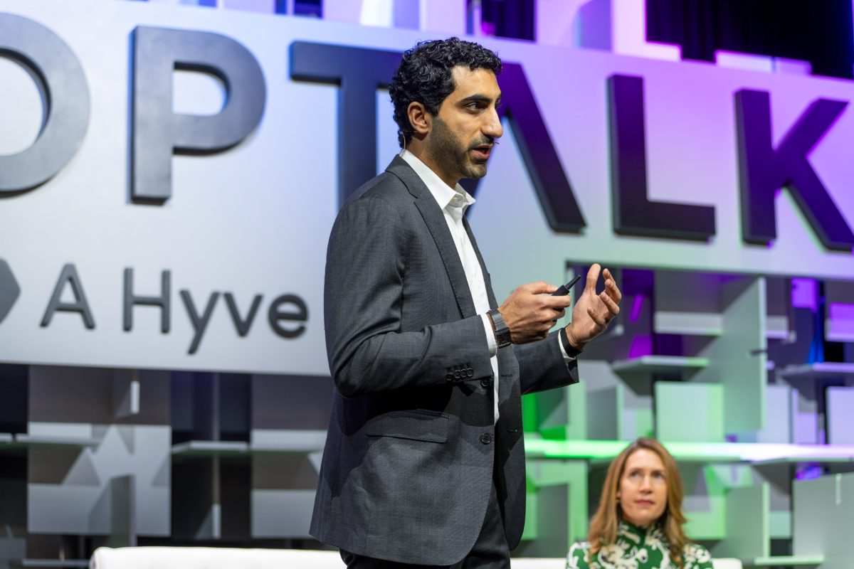 Speaking on stage at a conference