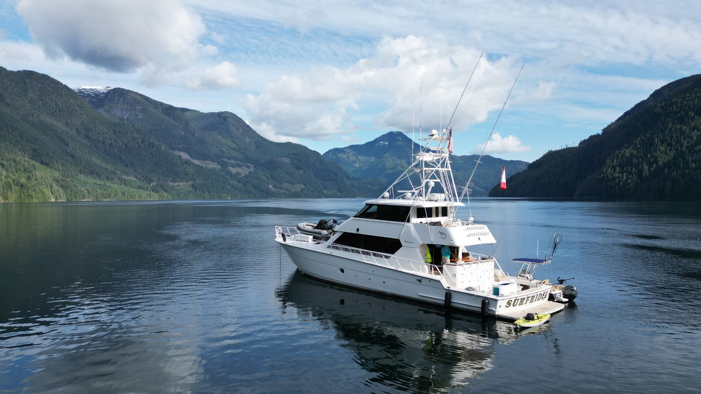 Surfrider at anchor in a mountain-lined British Columbia fjord
