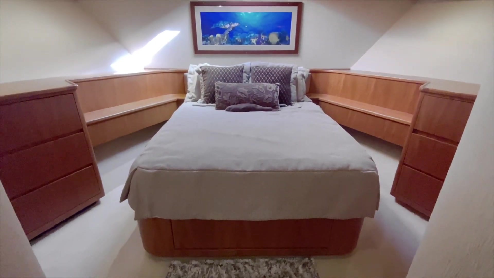 Stateroom with a bed and cabinetry