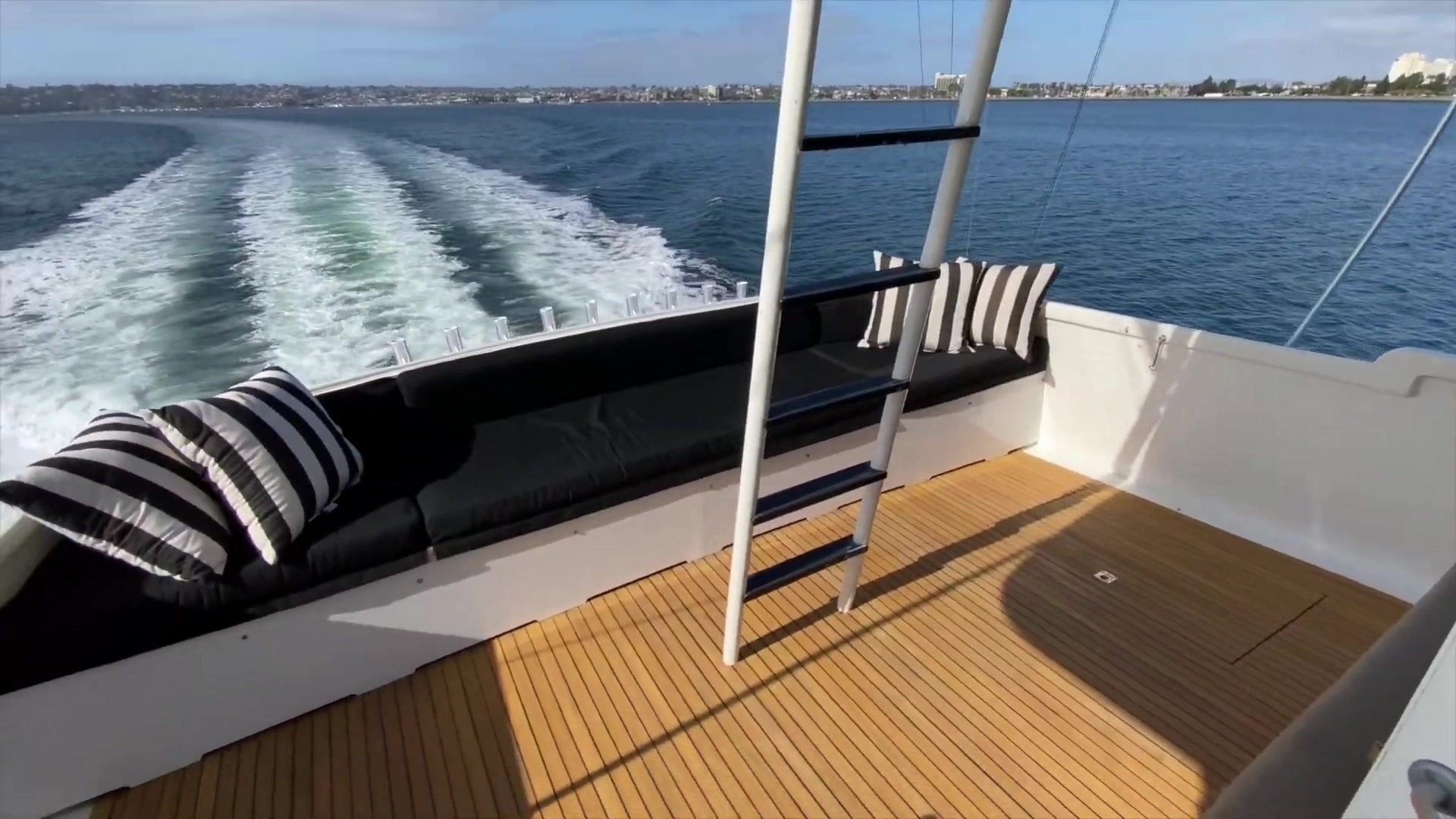 Upper aft deck with outdoor seating and views astern