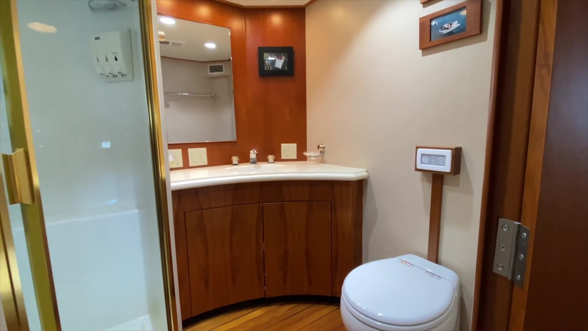 Ensuite bathroom with a vanity, mirror and toilet