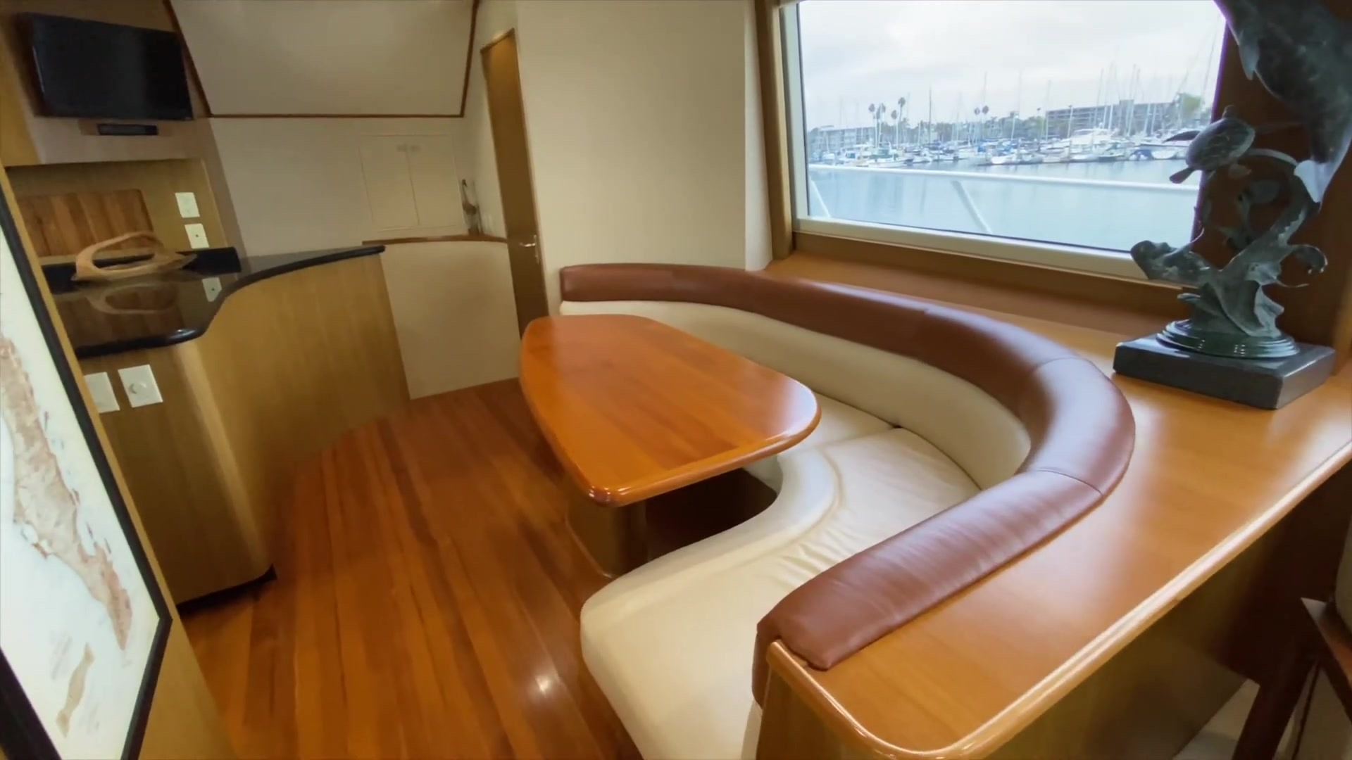 Curved indoor dining nook beside a window