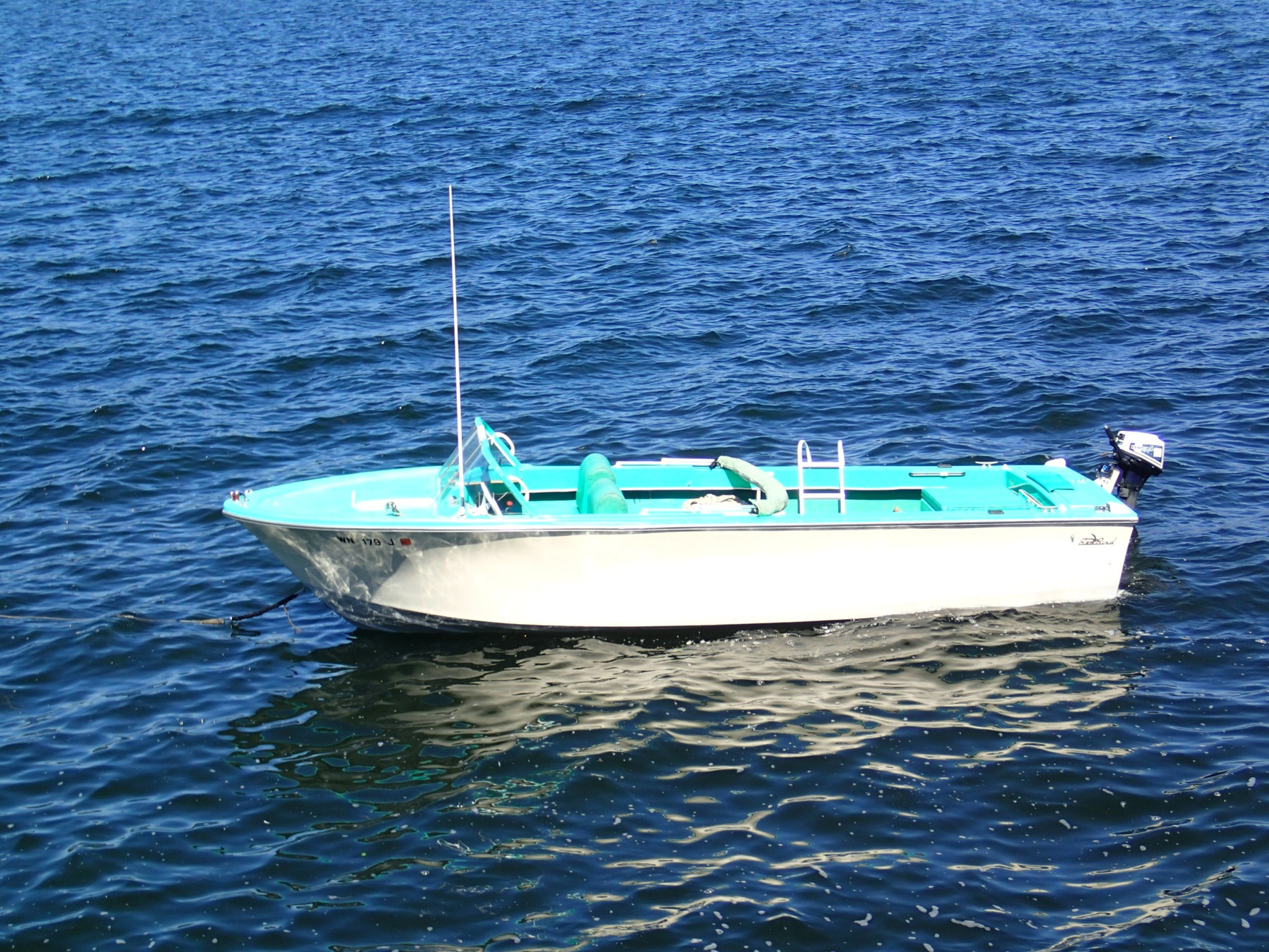 Seabird, the family boat, viewed broadside on the water