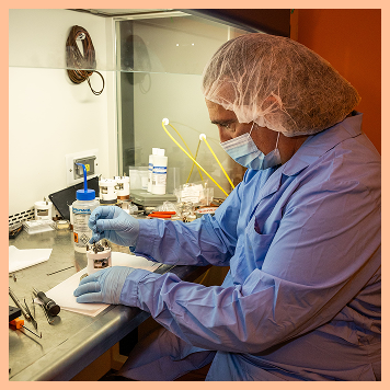 A GCE engineer refurbishing a control board at the bench