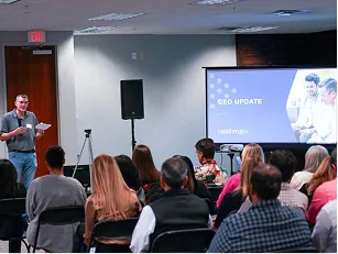 Healthmap team members attending a company update.