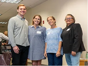 Four Healthmap team members at an event.