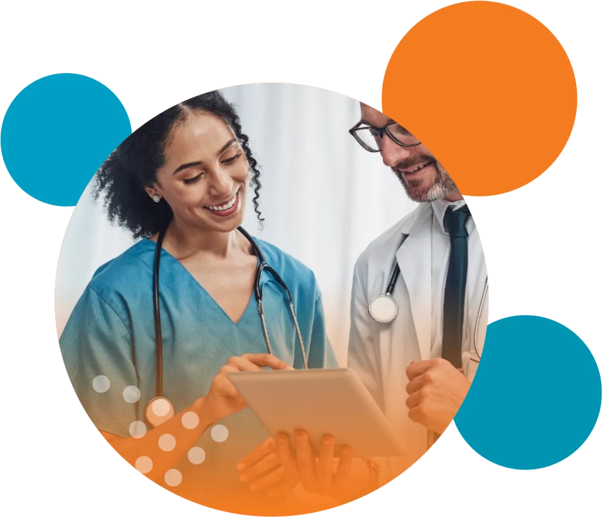 Two clinicians reviewing information on a tablet.