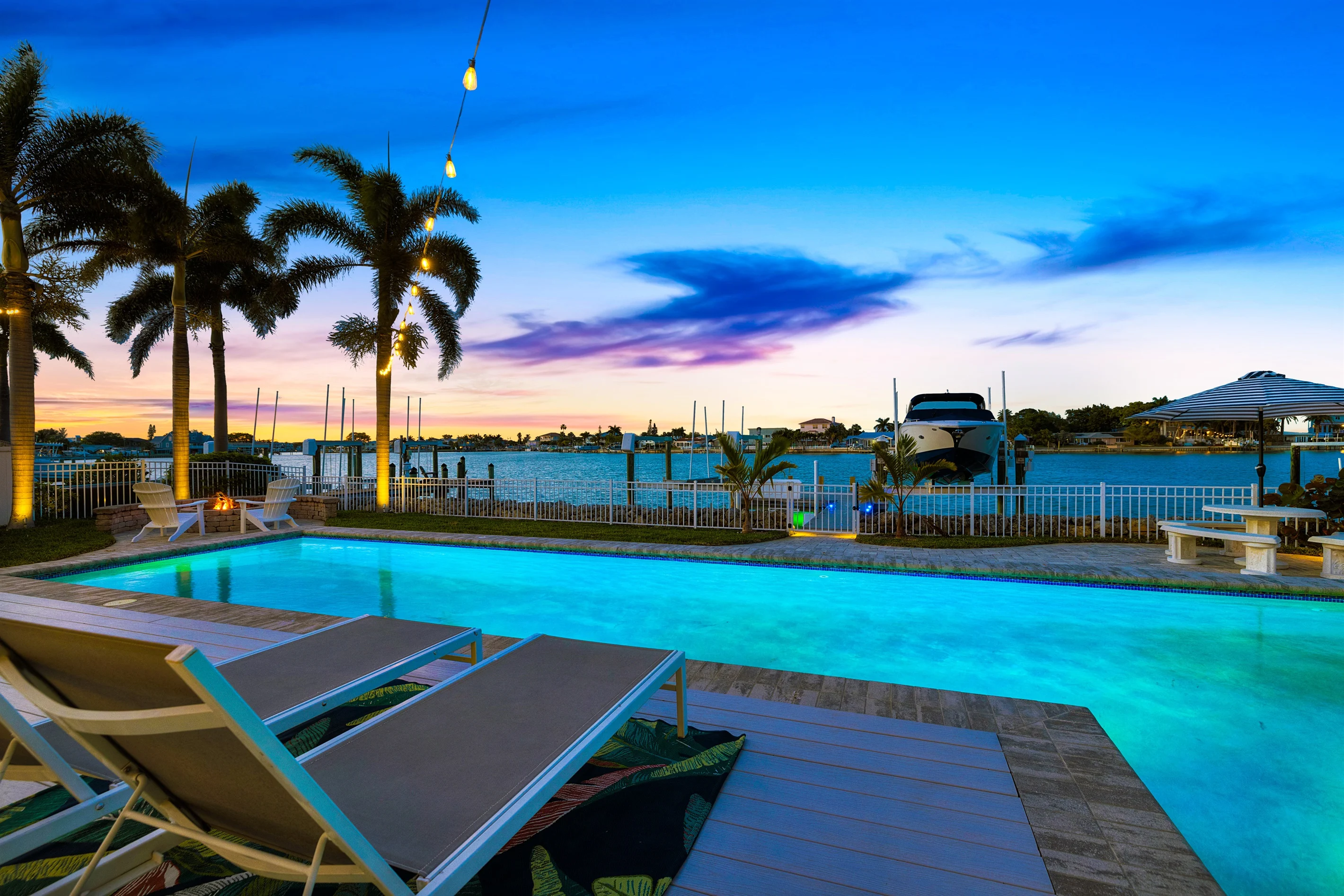 Waterfront pool, dock, and sunset over the Intracoastal